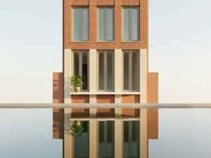 Narrow Amsterdam canal house facade in terracotta brick reflected in still water, tall windows with a potted plant on a white sill in golden morning light.